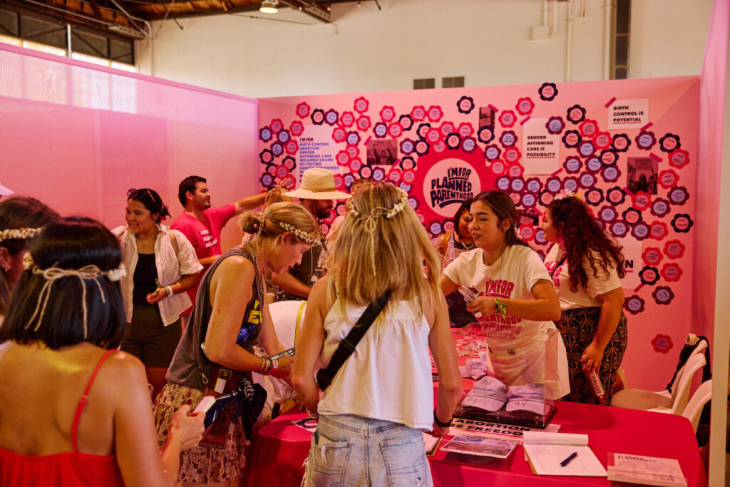 Planned Parenthood's booth at the Daisy Chain Reaction philanthropy village at Daisy Chain Fields 